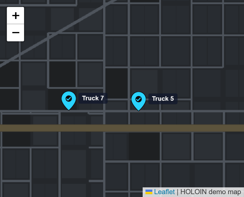 Truck 7 and Truck 5 on the demo map, both moving, each pin with its name beside it.