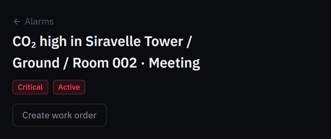 The Room 002 CO₂ alarm, critical and active, with Create work order.